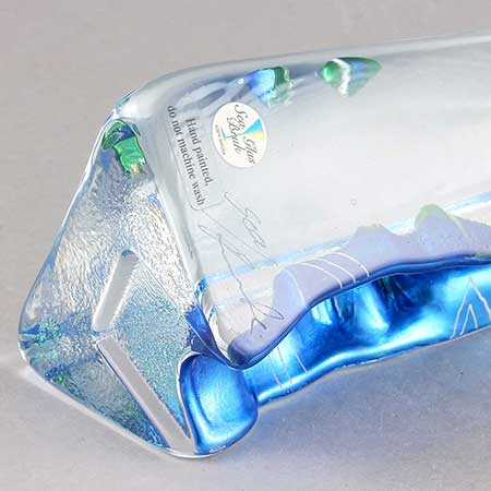 Lower side of a Renate Stock Paulsson object with signature and sticker